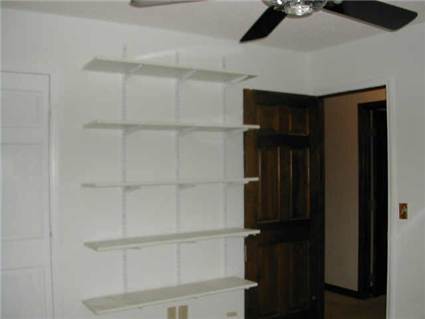 MLS Picture - Second bedroom with Shelfs